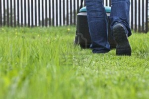 10283098-man-mowing-lawn-in-his-garden-in-summer